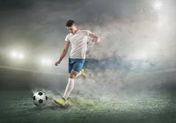 Foto op Canvas Soccer player on a football field in dynamic action at summer da © Andrii IURLOV