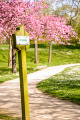 A sign on a wooden post reading the french word for 