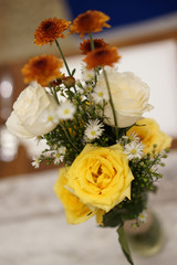 Flower in vase at table, setting for a wedding party, birthday, or dinner event