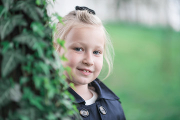 portrait of a beautiful blond girl looking straight into the camera