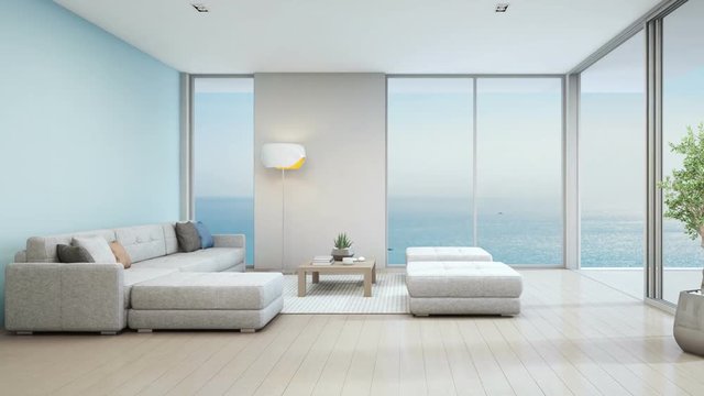 Sea view living room of luxury beach house with indoor plant near glass door and wooden floor deck. Big white sofa against blue wall in vacation home or holiday villa. Hotel interior 3d illustration.