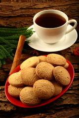 Breakfast table concept- cookies with cup of black coffee.