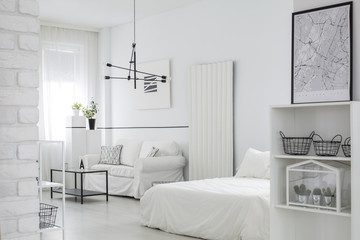 Furnished white bedroom interior