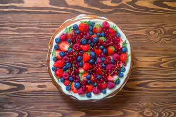 Top view delicious cake with berries