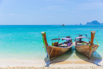 Fototapeta na wymiar Thailand Andaman Sea Travel with Long tail boats on Tropical beach Summer Holiday