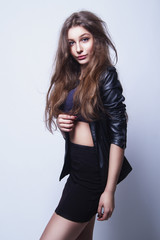 Beautiful girl in studio with brown long hair