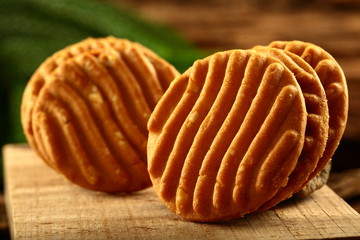 Stack of almond ,cashew cookies on a rustic background.
