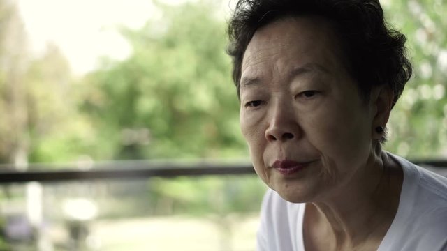 Asian senior woman stress and worry expression 4k
