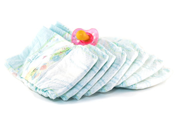 .Baby diapers and a pacifier on a white background, isolate - obrazy, fototapety, plakaty