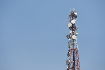 Telecommunication tower with antennas with blue sky