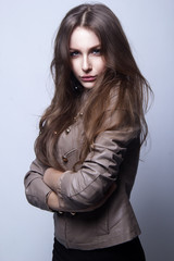 Beautiful girl in studio with brown long hair