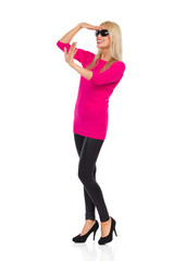 Fototapeta premium Happy Beautiful Woman Is Looking Away And Waving Hand