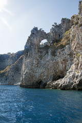 The weather station of Palinuro visible thru the big hole in the cliff face, Italy