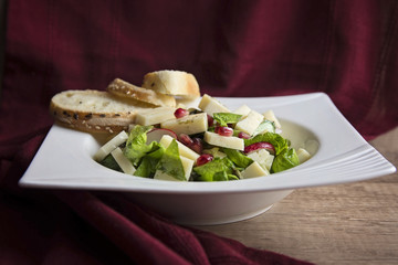 Green salad with cheese and pomegranate