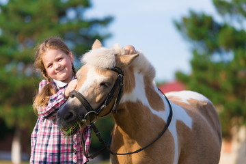 Fototapeta premium Pony. Face girl. Blue eyes. Close up