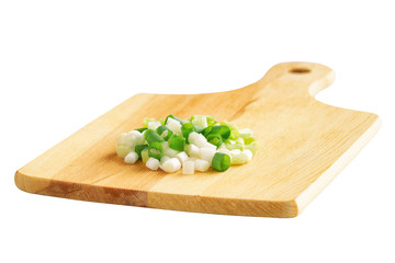Chopped fresh spring onion or scallions put on wood cutting board on white isolated background with clipping paths easy to use for all design. Concept to present prepare vegetable for soup cooking.