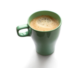 Soft focus green mug of coffee isolated on a white background