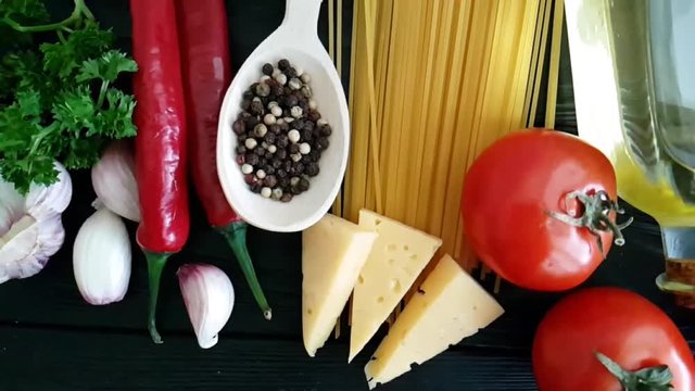 spaghetti, cheese, red pepper, garlic slow-motion shot