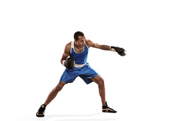 Fototapeta na wymiar Sporty man during boxing exercise making hit. Photo of boxer on white background