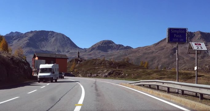 Driving on a mountain pass, Cinema 4k pov view driving on a road in the swiss alps, on route e62, on a sunny autumn day, on the top of the Simplon pass, in Valais, Switzerland
