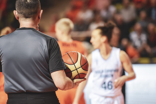 Referee Holds The Ball During Women Basketball Match