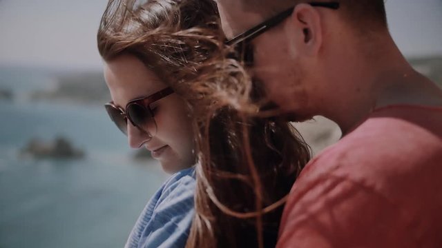 Loving happy and very beautiful couple walking near the ocean