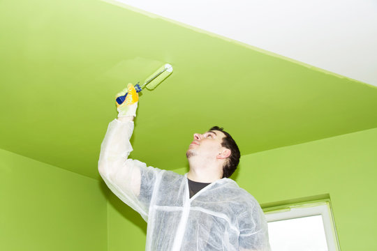 Man Painting A Ceiling