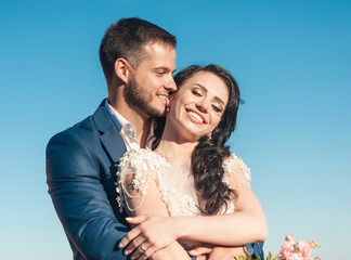 Bride and groom at wedding ceremony near sea
