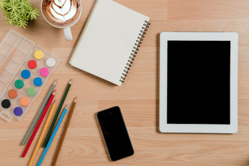 Office desk with colour pencils.