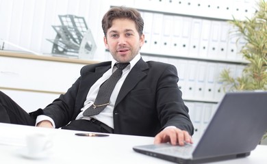 closeup of a senior Manager sitting at Desk