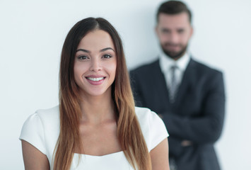 portrait of a business woman while the man is in the background
