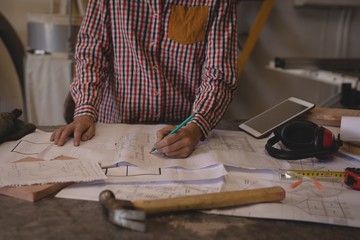 Female welder working in workshop