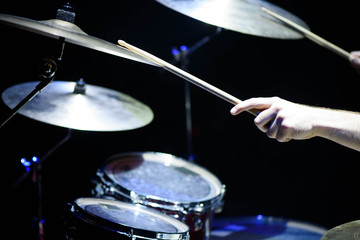 The drummer in action. A photo close up process play on a musical instrument