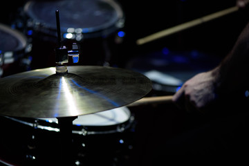 The drummer in action. A photo close up process play on a musical instrument