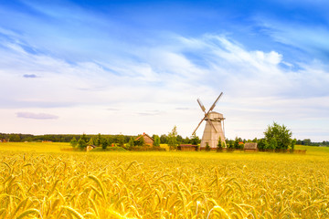 Wooden windmill on background field and sky. Dudutki village, Minsk Region, Belarus © Aleh Varanishcha