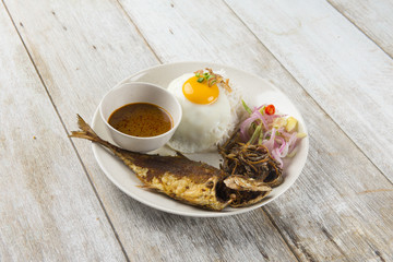 fried fish with rice with spices and curry