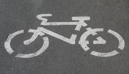 Fototapeta na wymiar white bicycle sign on the asphalt