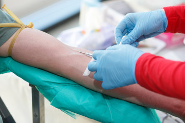 Blood donor at donation.
