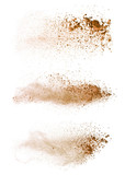 Abstract colored brown powder explosion isolated on white background.