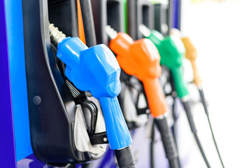 Colorful Petrol pump filling nozzles isolated on white background , Gas station in a service