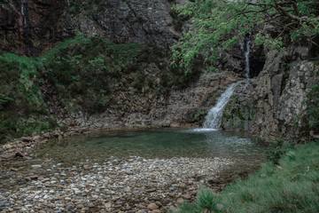 A waterfall in a mountains.