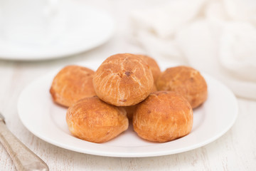 Brazilian snack cheese bread on white plate