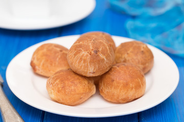 Brazilian snack cheese bread on white plate
