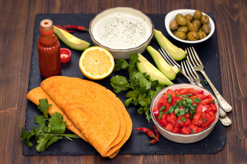 Mexican food in black ceramic board