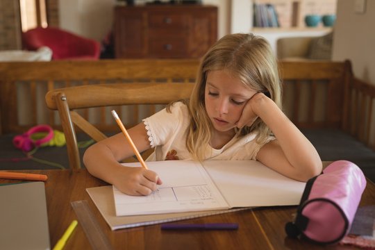 Girl doing her homework at home