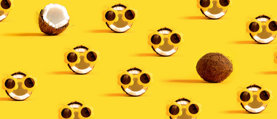 Series of coconuts wearing sunglasses on a yellow background