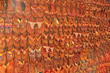 Leather slap-on shoes at the market market in India. Background of shoes. Shoes India