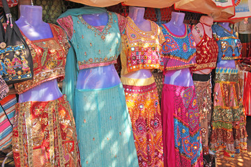 Sari Clothes India for women. Bazaar market in India. Bright saris are sold on the market in India