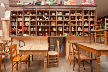 Interior of old restaurant with vintage decor, wooden furniture and retro details inside