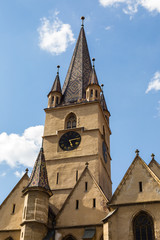 Fototapeta na wymiar Tower of Lutheran cathedral of Saint Mary in Romanian Sibiu